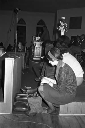 Man speaking to an audience at St. Paul AME Church in Birmingham, Alabama