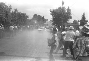 Car driving down a dirt road by participants in the "March Against Fear" through Mississippi, begun by James Meredith.