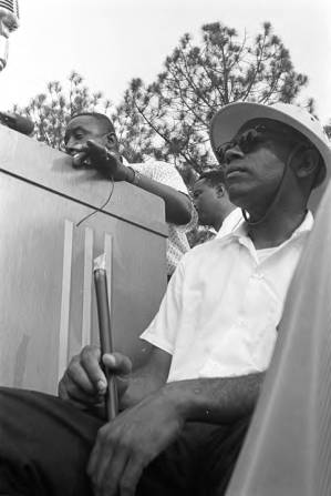 Floyd McKissick addressing an audience in front of the state capitol in Jackson, Mississippi, at the end of the "March Against Fear" begun by James Meredith.