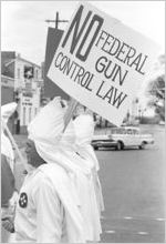 Klansmen carrying signs in a parade during a Ku Klux Klan rally in Montgomery, Alabama.