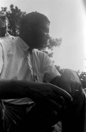 Whitney M. Young, Jr., seated on a platform in front of the state capitol in Jackson, Mississippi, at the end of the "March Against Fear" begun by James Meredith.