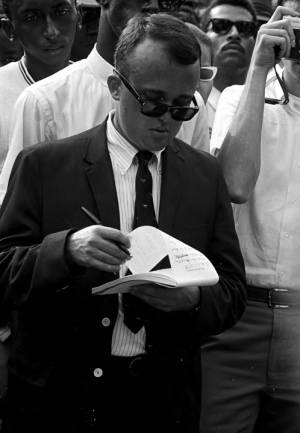 Journalist taking notes during the rally in front of the state capitol in Jackson, Mississippi, at the end of the "March Against Fear" begun by James Meredith.