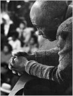 Man sitting in an audience at Tabernacle Baptist Church in Selma, Alabama, probably listening to Martin Luther King, Jr., speak.