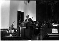 Man Speaks to People at a Church, circa 1974