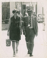 Joseph and Evelyn Lowery Walking Down the Street, circa 1955