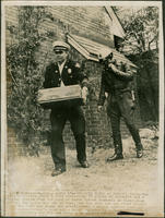 Policeman Carrying a Box of Dynamite from Birmingham Mayor's Home, 1965