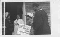 Operation Breadbasket Workers Speaking to Residents at a House, circa 1970