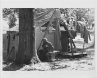An Unidentified Older Man Sitting on a Cot Outside of a Tent in Resurrection City, 1968