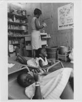 Two Young Girls Lie on Cots in a Tent in Resurrection City, 1968