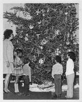Evelyn G. Lowery and a Group of Children Admiring a Christmas Tree, circa 1970