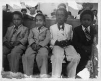 A Group of Young Boys Sitting in a Church Pew During the National Women's Candlelight Prayer Service, April 5, 1981