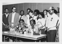 Joseph E. Lowery and Others Listen as Douglass Dean Speaks to the Press, November 1985