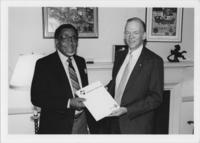 Joseph E. Lowery and Dr. Lewellys Barker Hold an AIDS Information Booklet, circa 1987