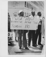 A Jobs and Peace Rally Attendee Holds a Protest Sign, April 1983