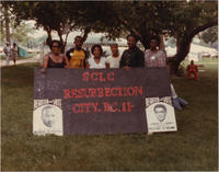 A Group of People Holding a "SCLC Resurrection City II" Sign, 1982