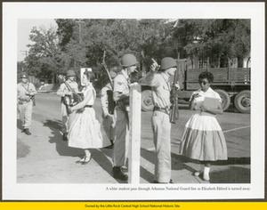 White female student passes National Guard troops as Elizabeth Eckford is turned away