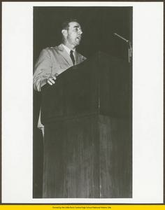 Unidentified officer speaking from lectern