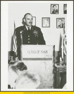 Unidentified officer speaking to students