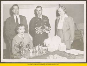 Captain Madden, an unknown man, and two unknown women at a faculty tea