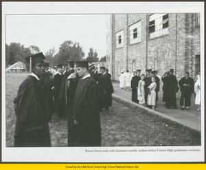 Ernest Green waiting with a classmate to enter stadium for graduation ceremony