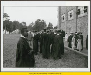 Ernest Green waiting to enter stadium for graduation ceremony