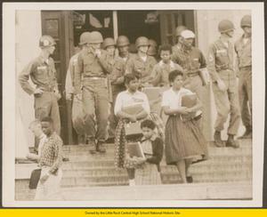 Black students leaving Central High School guarded by 101st Airborne soldiers