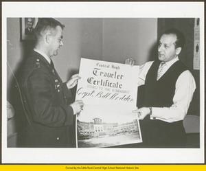 Captain Madden presented with "Central High Traveler" certificate by Mr. Paul Magro