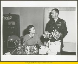 Captain Madden and an unknown women at a faculty tea