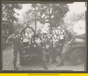 Sergeant Neubauer, Sergeant Hamby, Private Parkes, Private McArthur, and Sergeant Montez with the 101st Airborne soldiers holding teddy bears
