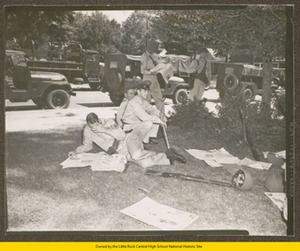 National Guardsman relaxing in shade on Central High School grounds