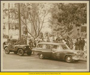 Black students exiting Army station wagon