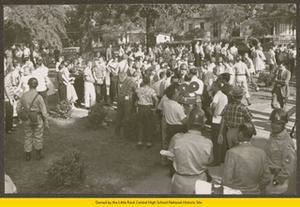 White students, soldiers, and newsmen in front of Central High School