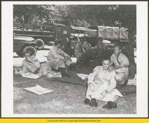 National Guardsman relaxing in shade on Central High School grounds