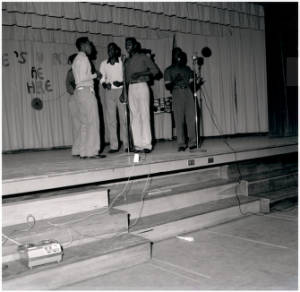 Singing group of George Washington Carver students performing on stage