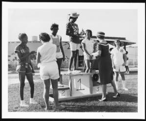 Barbara Williams, of George Washington Carver Senior High School, accepting a track trophy