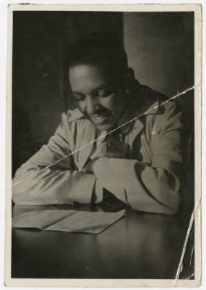 Man reading while sitting at desk