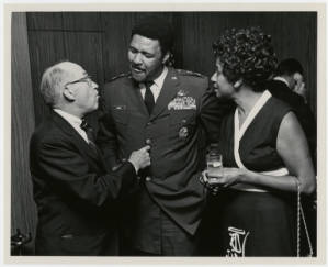 Aubrey Watkins Simms conversing with gentlemen