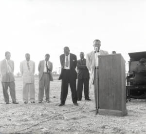 Group of people attending Baptist church groundbreaking ceremony