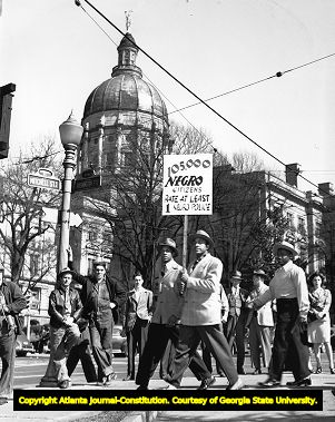 Demonstrators outside the state capitol advocating the need for African-American police officers, 1946