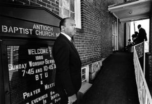 Congressional candidate John Lewis waiting to speak at Antioch Baptist Church during a campaign rally, 1986