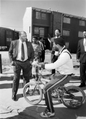 Representative John Lewis speaking with residents in Bankhead on issues with the neighborhoods infrastructure, 1989