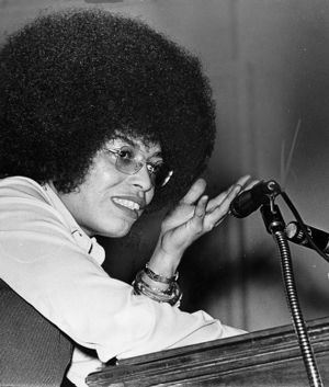 Political activist Angela Davis speaking at the Atlanta University Center to raise money for political prisoners, 1972
