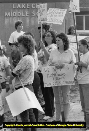 Parents picket outside Lake City Middle School, protesting the attendance of a 12-year-old boy with AIDS, Lake City, Tennessee, September 10, 1987.