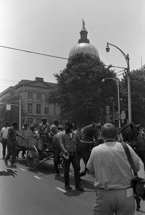 "Liberation Train" protestors near the Georgia State Capitol building heading northeast on Martin Luther King Dr , Atlanta, Georgia, May 23, 1970.