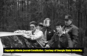Georgia Bureau of Investigation officers arresting white supremacists at the Forsyth County freedom march, Georgia, January 17, 1987.