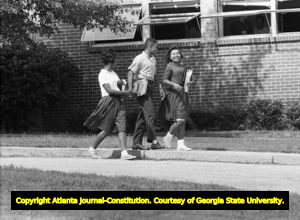 Three African American students leaving Northside High School (later North Atlanta High School) on the first day of its racial integration, Atlanta, Georgia, August 30, 1961.