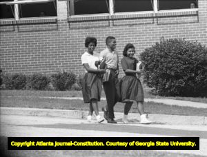 Three African American students leaving Northside High School (later North Atlanta High School) on the first day of its racial integration, Atlanta, Georgia, August 30, 1961.