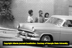 Three African American students leaving Northside High School (later North Atlanta High School) on the first day of its racial integration, Atlanta, Georgia, August 30, 1961.