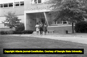 Three African American students leaving Northside High School (later North Atlanta High School) on the first day of its racial integration, Atlanta, Georgia, August 30, 1961.