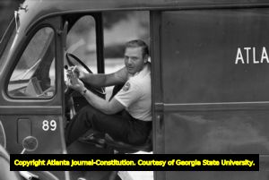 Police van standing by at Northside High School (later North Atlanta High School) on the first day of its racial integration, Atlanta, Georgia, August 30, 1961.